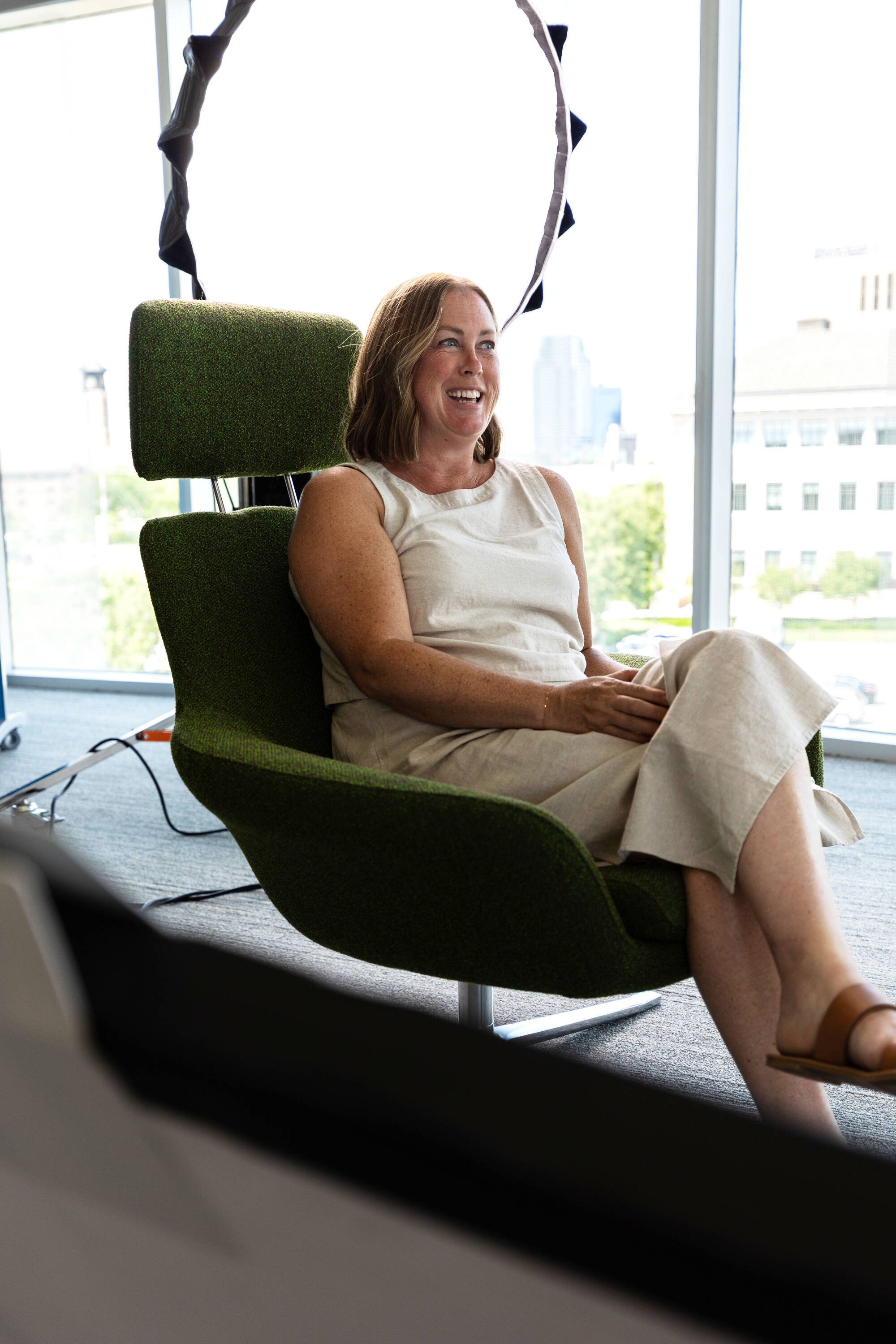 Megan Wierenga sitting in a chair and smiling